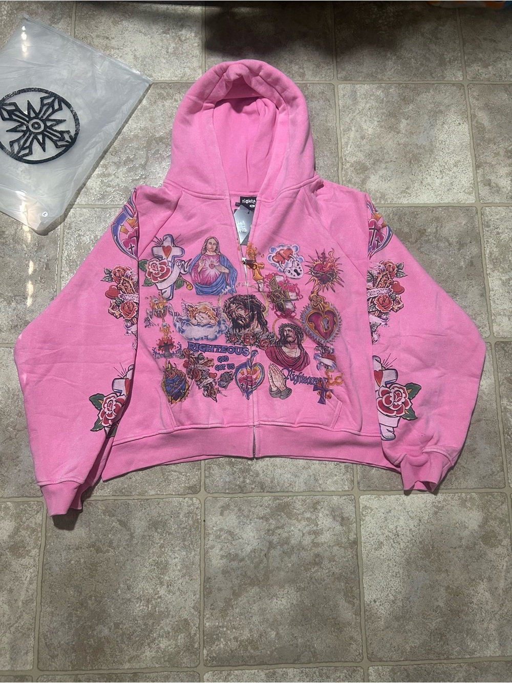 Righteous pink zip up hoodie with Jesus and angel designs. Size: L